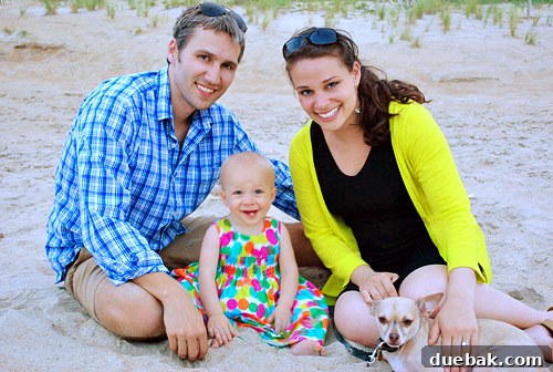 Sun-Drenched Serenity: A Duck Beach Getaway 10 First family photo of four