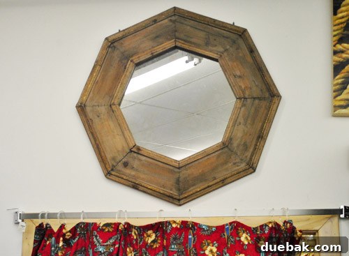Octagonal mirror with rustic wooden frame