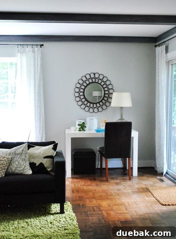 Living room with gray-washed beams and console table