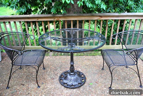 Transformed patio table and chairs in oil-rubbed bronze, looking elegant