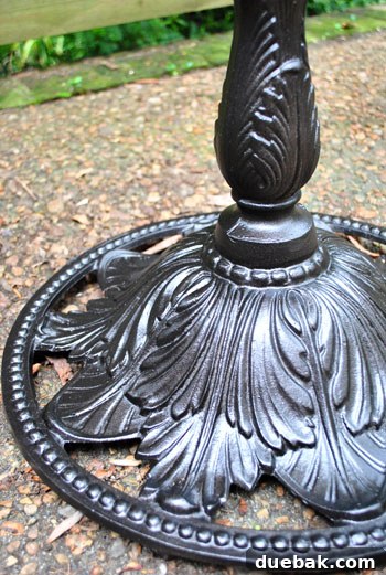 Detail of the spray-painted patio table surface, showcasing the new oil-rubbed bronze color