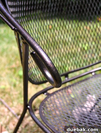 Newly spray-painted patio furniture piece glistening in the sun