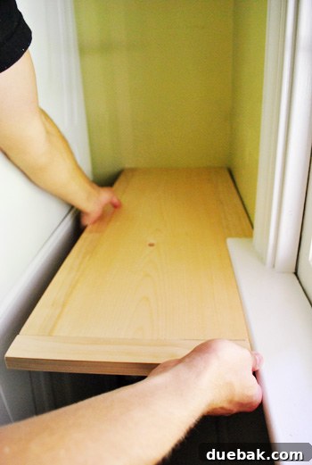 Testing middle shelf placement with window sill