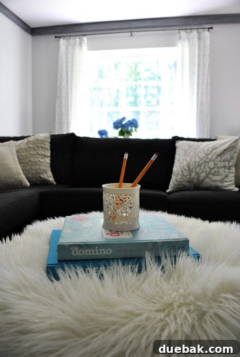 Ottoman with Faux Sheepskin Throw