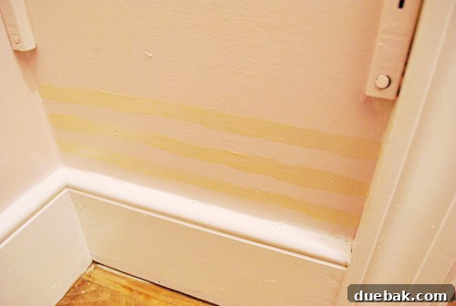 Experiment with freehand imperfect horizontal metallic lines on the closet wall