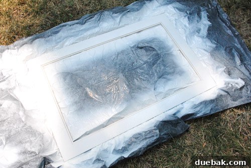 From Drab to Fab: Spray Paint Frame Makeover 15 Painted white mat next to the newly painted dark frame