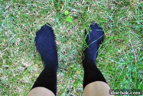 From Drab to Fab: Spray Paint Frame Makeover 16 Blogger's legs in black socks, spray painting
