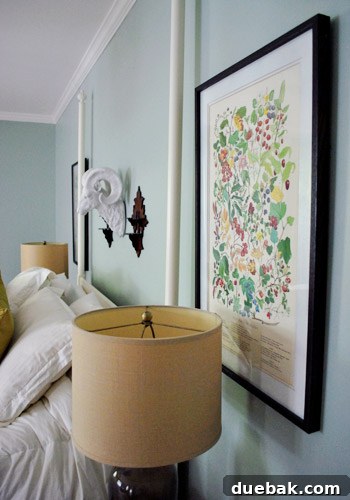 From Drab to Fab: Spray Paint Frame Makeover 17 Alaskan botanical prints in newly painted dark frames with white mats, hung in the bedroom