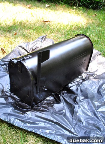 Newly spray-painted oil-rubbed bronze mailbox, looking shiny and updated
