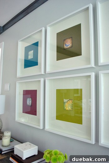 A wider shot of the wall displaying the newly refined framed art