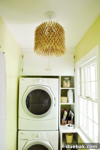 Finished clothespin chandelier hanging in the room