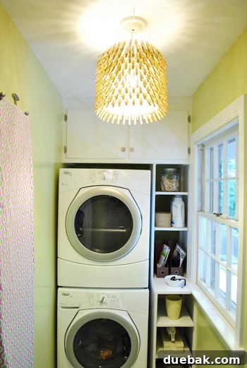 Clothespin chandelier illuminated in the room