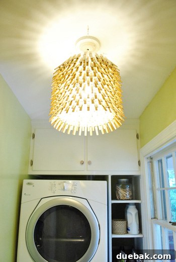 Starburst pattern cast by the chandelier on the ceiling