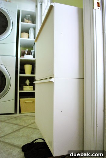 Final look of organized laundry room entryway with shoe cabinets
