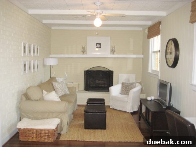Transforming Your Stark Living Room into a Cozy Haven 2 Before image of a den, showing a somewhat sparse and less inviting long, narrow room layout.