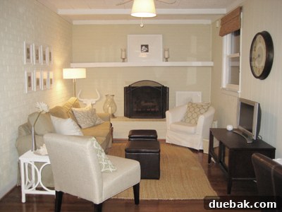 Transforming Your Stark Living Room into a Cozy Haven 3 After image of the den, showing a warmer and more welcoming space with added furniture and accessories.