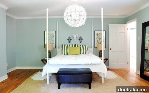 Frame Fusion: Spray Paint for Cohesive Style 3 Unfinished side of a bedroom with a bed, nightstands, and art