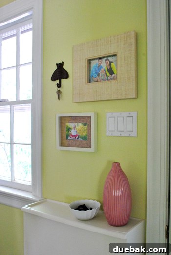 From Drab to Dreamy: Our Laundry Room Makeover 12 Laundry room wall decor featuring family photos above shoe cabinet, enhancing personal touch