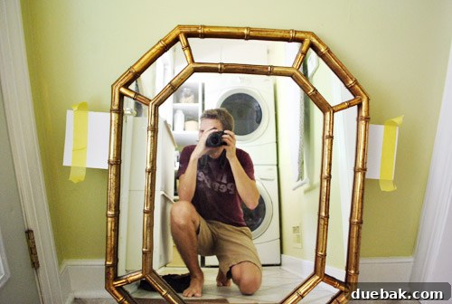 From Drab to Dreamy: Our Laundry Room Makeover 5 DIY mirror hanging technique using paper and tape to mark drill spots precisely