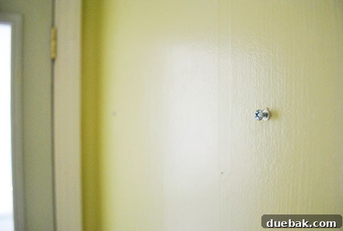 From Drab to Dreamy: Our Laundry Room Makeover 8 Heavy duty anchors and screws installed on the wall for secure mirror hanging
