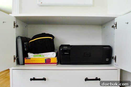 Clever Printer Concealment Ideas 13 Front view of the cabinet's interior with the printer, showcasing the complete absence of visible cords for a clean setup.