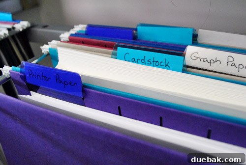 Clever Printer Concealment Ideas 16 A dedicated section inside the file cabinet used for storing various types of printer paper, ensuring easy access.