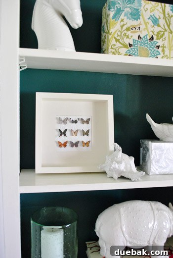 Craft Your Own Whimsical Butterfly Display 3 Close-up of the finished faux butterfly framed art displayed on built-in shelves