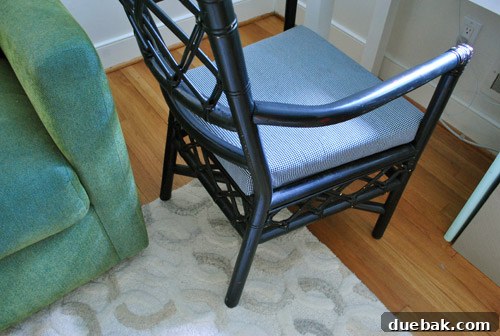 Close-up of a desk chair struggling to move over a rug, highlighting a layout issue.