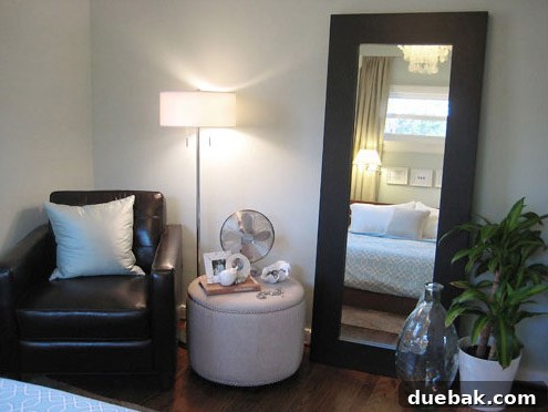 Another view of the master bedroom in the first house, showcasing its finished and organized aesthetic
