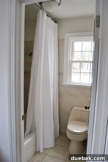 Current house master bathroom, attached to the bedroom, displaying a bisque toilet and awaiting renovation