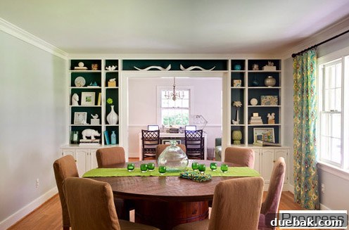 Elegant dining room in the current house, featuring dark teal built-ins and stylish curtains