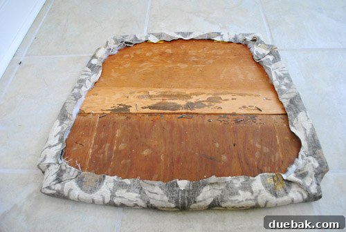 Underside of the upholstered seat, showing all staples and finished edges