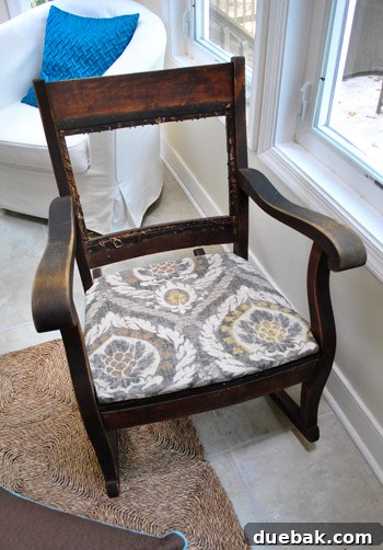 Upholstered seat perfectly fitted into the rocking chair frame