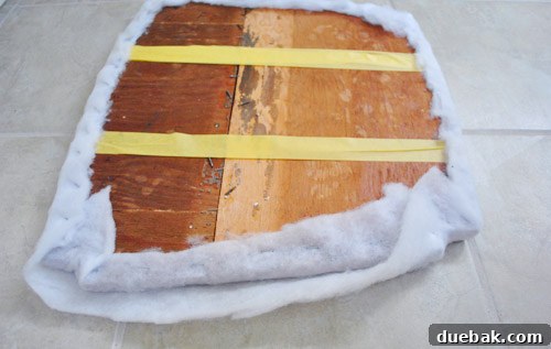 Second layer of extra-loft batting applied to the rocking chair seat