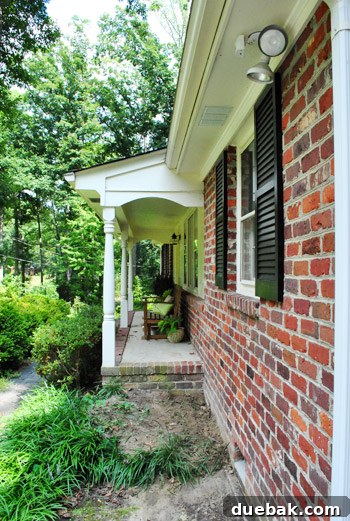 View of the house after camellia removal, showing space