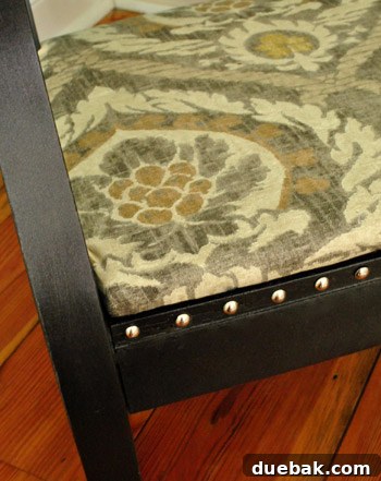 Transform Your Rocking Chair with Fabric and Nailhead Upholstery 18 Finished rocking chair with nail head trim on panels and wood frame