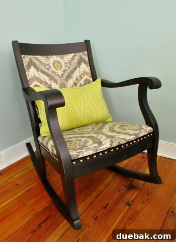 Transform Your Rocking Chair with Fabric and Nailhead Upholstery 21 Rocking chair styled with a green HomeGoods pillow