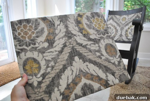 Transform Your Rocking Chair with Fabric and Nailhead Upholstery 10 Second upholstered panel being attached to the chair back