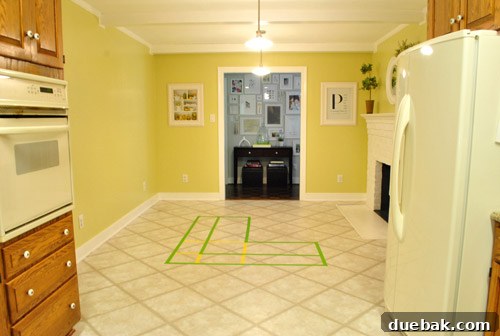 Kitchen Unfiltered 9 Kitchen floor taped out to visualize the L-shaped banquette