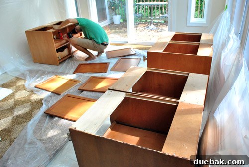 Cabinet Painting Prep for a Perfect Finish 2 Cabinet doors and hinges removed, ready for refinishing