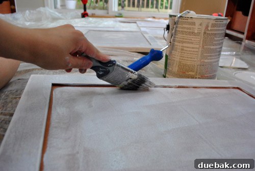 Cabinet Painting Prep for a Perfect Finish 13 Using a brush for cabinet frame details, then re-rolling for smooth finish