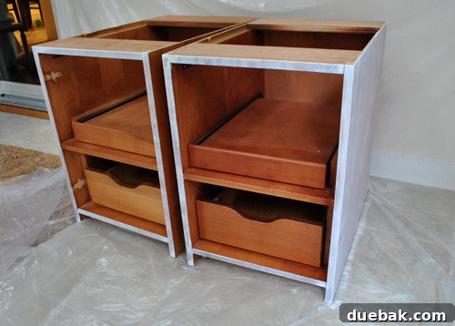 Cabinet Painting Prep for a Perfect Finish 14 Freehand priming cabinet frames without tape for clean lines