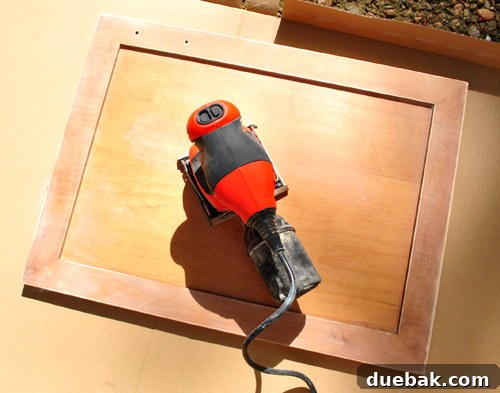 Cabinet Painting Prep for a Perfect Finish 6 Using a Black & Decker electric sander on cabinet doors