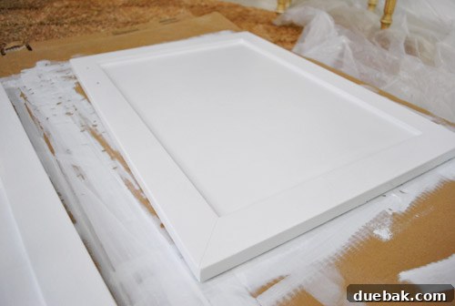 From Thrifted Cabinets to a Massive Shared Desk 14 Finished cabinet door after three coats of paint