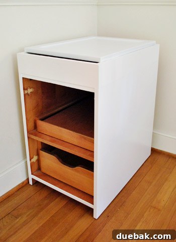 From Thrifted Cabinets to a Massive Shared Desk 17 Fully painted cabinet base with a door resting on top