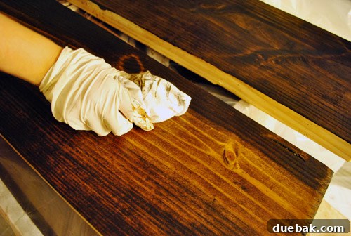 Wiping off excess stain with a rag