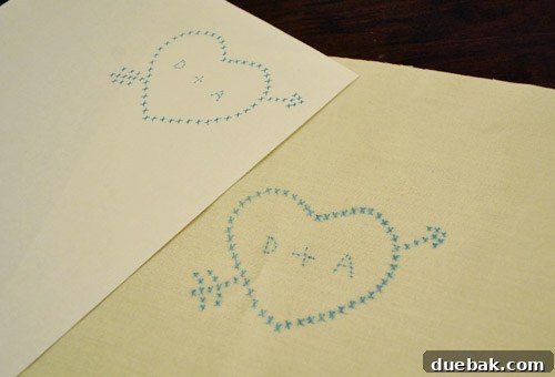 Detail of the cross-stitch design traced with a marker