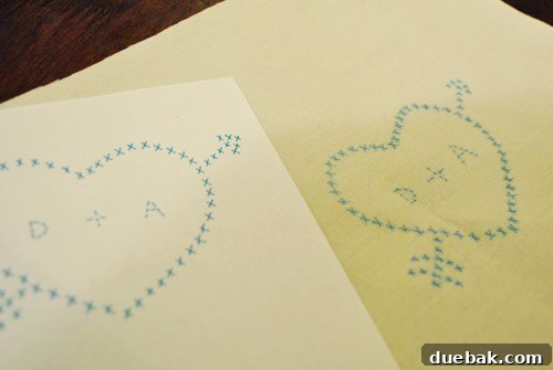 Close-up of the cross-stitch heart and arrow design