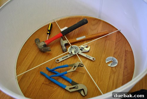 Revitalize Your Old Chandelier With Paint and a Shade Swap 13 Stubborn metal ring on drum shade, showing minor dents