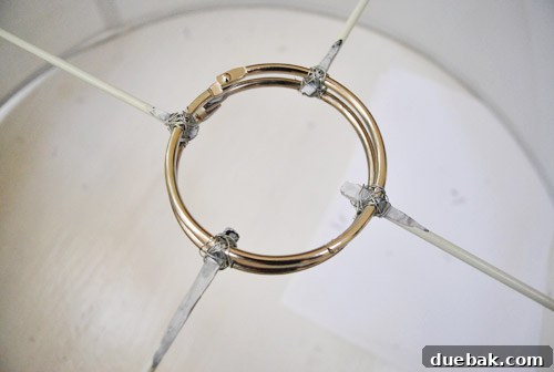 Revitalize Your Old Chandelier With Paint and a Shade Swap 16 Binder rings and craft wire securing the drum shade rods
